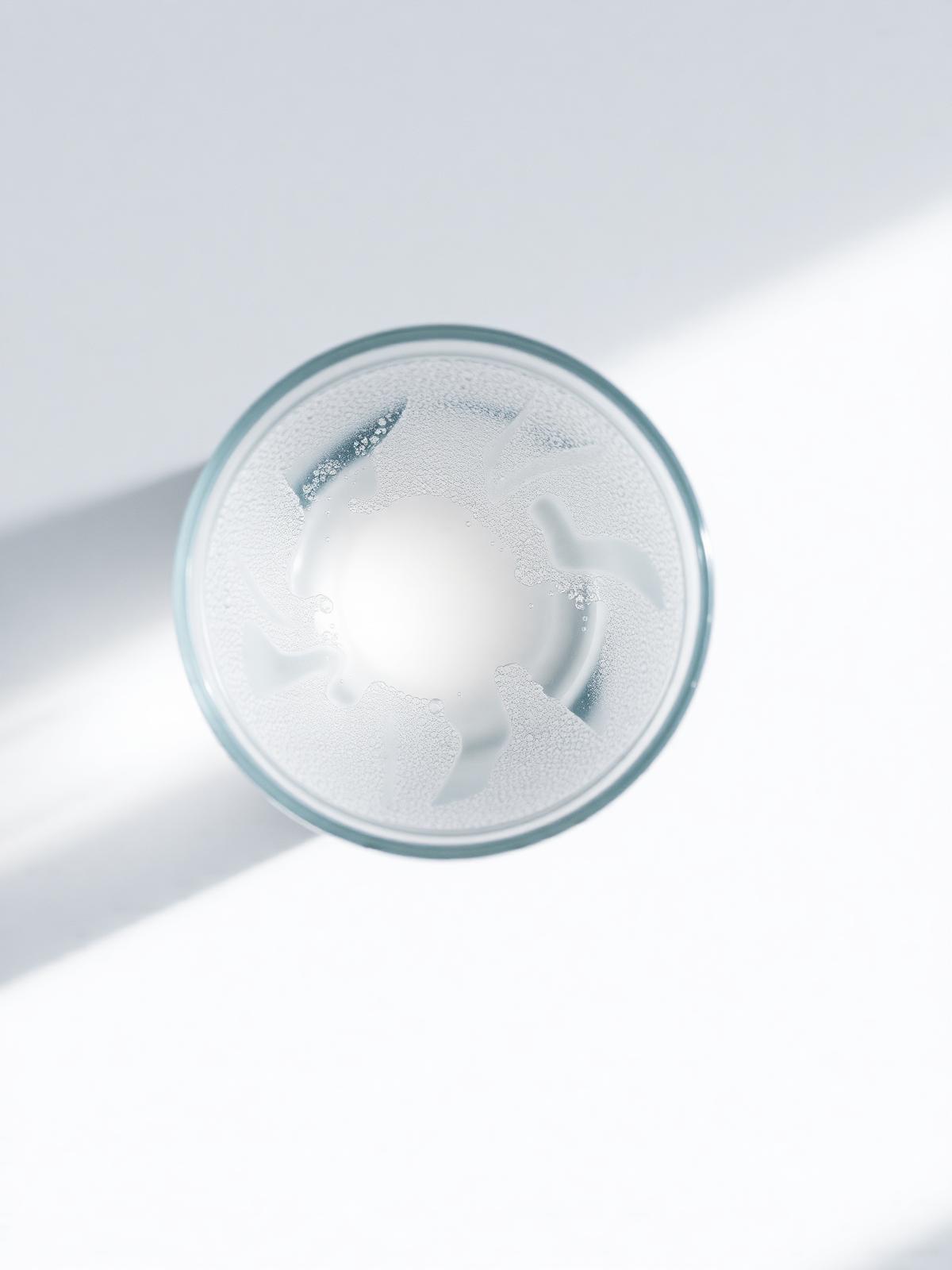 Frosted glass of mineral water photographed from above, ready to be blessed